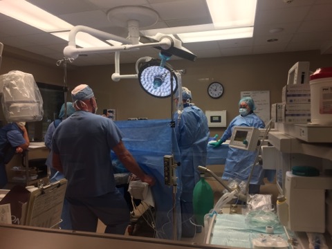 Dr. Andrew Will and surgical team implanting proclaim spinal cord stimulator in operating room