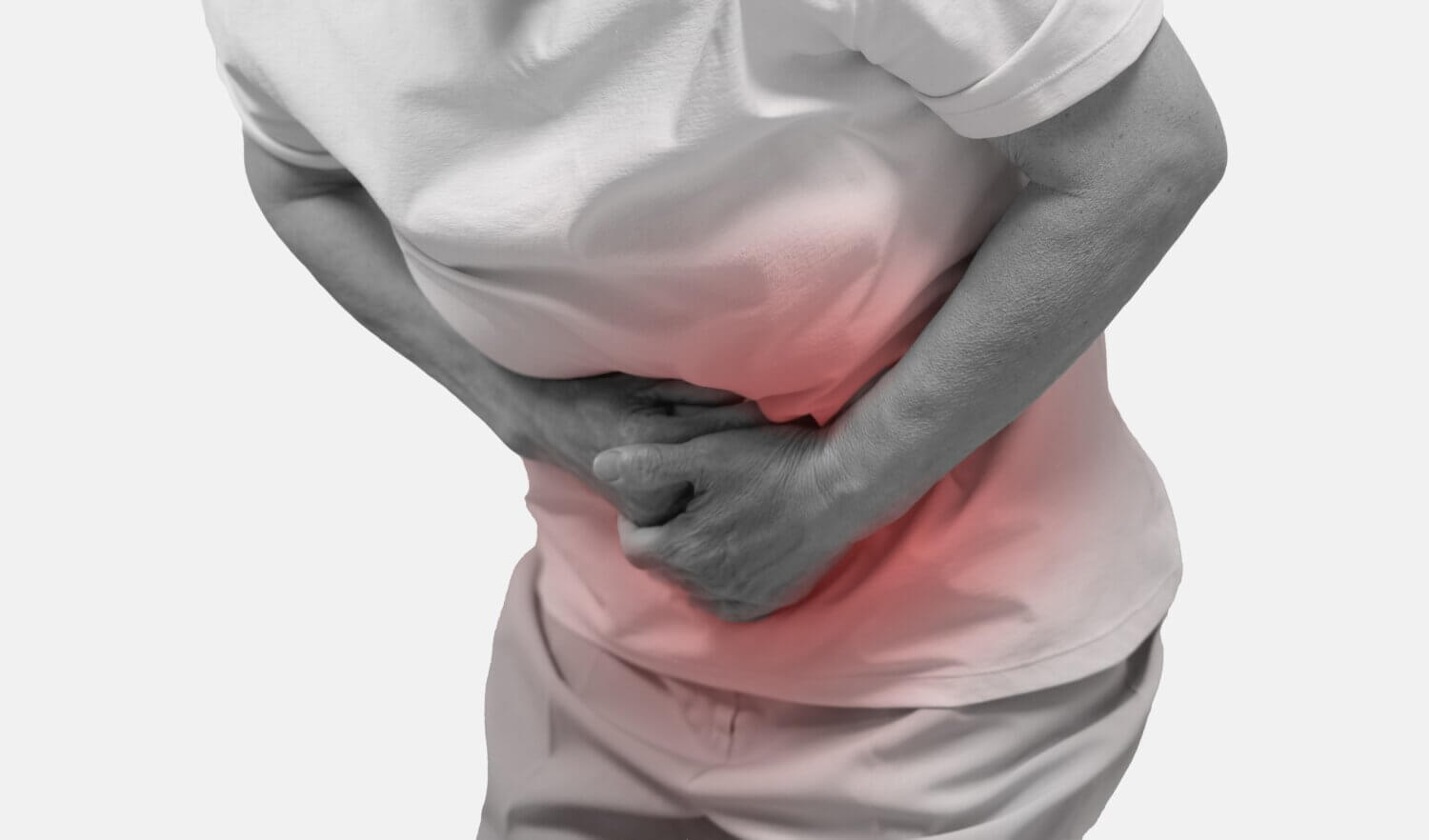 Black and white image of a senior grasping their stomach which is glowing red to indicate abdominal pain